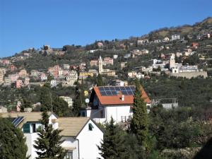 a group of houses with a solar roof at Quarto di Luna in Genoa