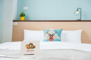 Postel nebo postele na pokoji v ubytování D.C. Inn