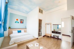 Postel nebo postele na pokoji v ubytování D.C. Inn