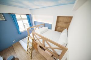 Postel nebo postele na pokoji v ubytování D.C. Inn