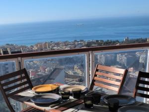 a table with a view of the city from a balcony at Quarto di Luna in Genoa