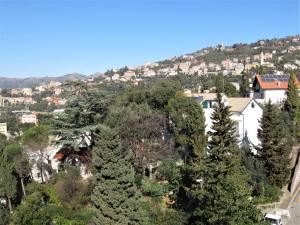 a view of a city with trees and houses at Quarto di Luna in Genoa