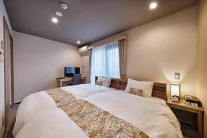 Katil atau katil-katil dalam bilik di Stay SAKURA Kyoto Kiyomizu Gojo