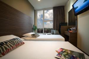 Value Hotel Thomson客房内的一张或多张床位