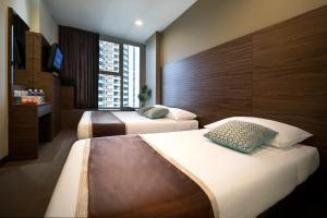 Postel nebo postele na pokoji v ubytování Value Hotel Thomson + 15 fotografií