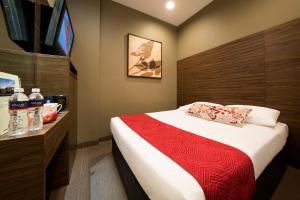 Value Hotel Thomson客房内的一张或多张床位
