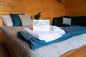 Postel nebo postele na pokoji v ubytování Hetényi Apartmanház és Birtok