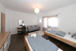 Postel nebo postele na pokoji v ubytování Apartments Gacka Valley