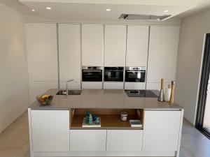 A kitchen or kitchenette at Villa las Colinas Golf Resort