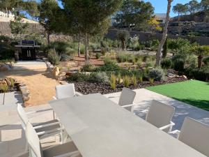A garden outside Villa las Colinas Golf Resort
