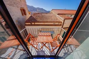 an overhead view of a balcony with tables and chairs at Balcone Rugiada in Cefalù