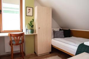 Postel nebo postele na pokoji v ubytování Hetényi Apartmanház és Birtok
