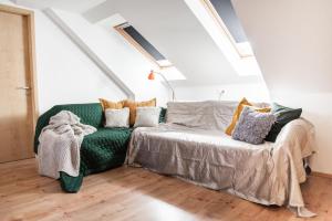 Postel nebo postele na pokoji v ubytování Hetényi Apartmanház és Birtok