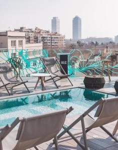 a group of chairs sitting on top of a roof at Hotel Rec Barcelona - Adults Only in Barcelona
