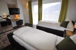 Postel nebo postele na pokoji v ubytování Hotel Martina