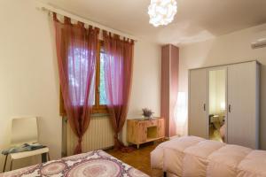 Postel nebo postele na pokoji v ubytování Casa Renalda