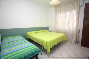 A bed or beds in a room at Residence Stella Polare