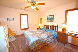 a bedroom with a bed and a ceiling fan at Fountain Road 13701 in Ocean City