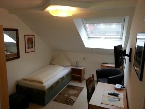Postel nebo postele na pokoji v ubytování Hotel Am Kamin