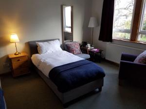 מיטה או מיטות בחדר ב-Rowanbank House