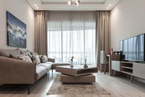 a living room with a couch and a table at Lahoya Homes in Beirut