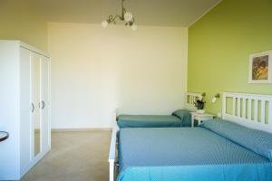 Postel nebo postele na pokoji v ubytování B&b Noto beach