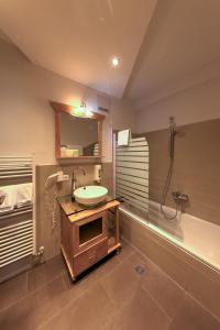Baðherbergi á Hotel Leimer Bräu