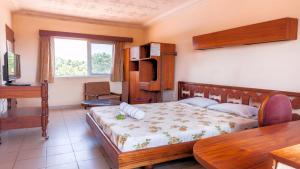 Postel nebo postele na pokoji v ubytování Hôtel L'Auberge