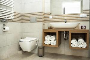 Kúpeľňa v ubytovaní Apartamenty Leśna 1