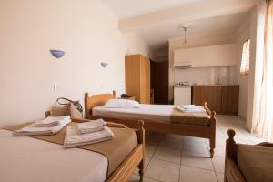 Postel nebo postele na pokoji v ubytování Atira Apartment Hotel