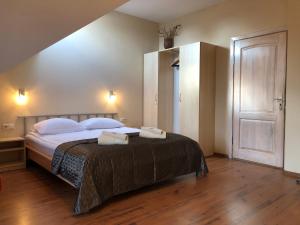 Postel nebo postele na pokoji v ubytování Apartamentai Viktorija