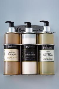 a group of three bottles of hair products on a shelf at Ceol na Mara Guest House in Tarbert