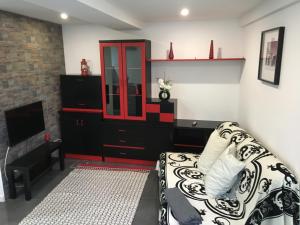 a living room with a couch and a fireplace at Escadinhas da Sé in Viseu