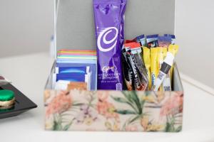 a bag filled with toothpaste and other items on a table at Ceol na Mara Guest House in Tarbert