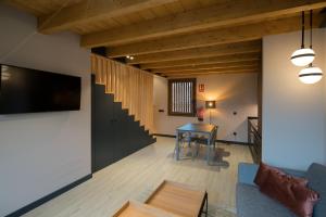 TV a/nebo společenská místnost v ubytování Apartamentos y Villas La Santilar