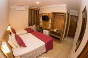 En eller flere senge i et værelse på Pousada Villarejo Armação + 74 billeder