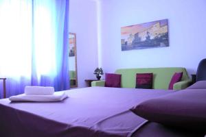A bed or beds in a room at B&B Selvarossa