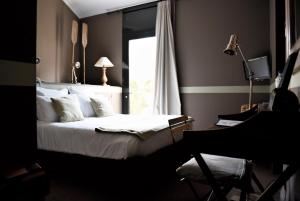 מיטה או מיטות בחדר ב-Hôtel Particulier - La Chamoiserie