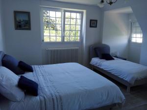 Кровать или кровати в номере Villa des Fleurs d'Ajoncs