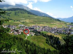 a town on a hill with a red circle at Lärchenhof Serfaus in Serfaus