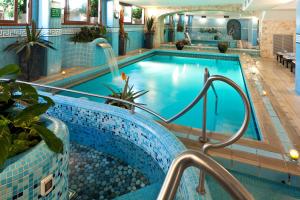 a pool in a hotel room with a swimming pool at Le Querce Resort Sea Thermae & Spa in Ischia