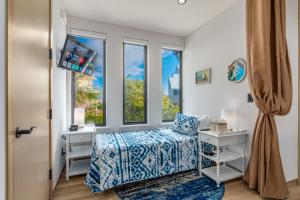 a bedroom with a bed and a window at Nirvana Shores in Stuart +129 photos