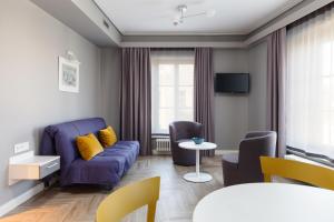TV a/nebo společenská místnost v ubytování Somnia Apartments