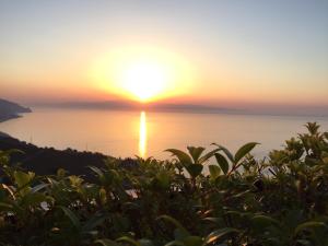 a sunset over the ocean with the sun setting at B&B La Terrazza Sul Mare Taormina in Taormina