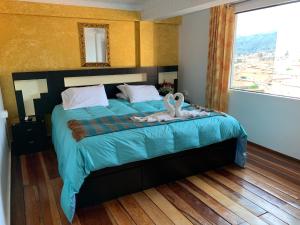 Katil atau katil-katil dalam bilik di Hostal Qolqampata