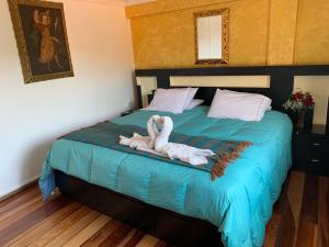 Katil atau katil-katil dalam bilik di Hostal Qolqampata