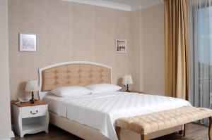 Postel nebo postele na pokoji v ubytování Casa Grande Otel