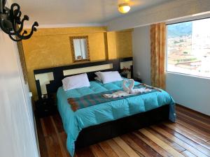 Katil atau katil-katil dalam bilik di Hostal Qolqampata