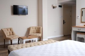 TV a/nebo společenská místnost v ubytování Casa Grande Otel