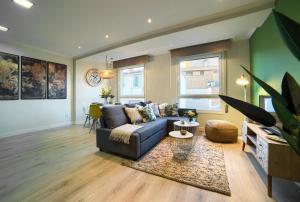 a living room with a couch and a table at Apartamentos4U Tudela Centro - Parking incluido in Tudela
